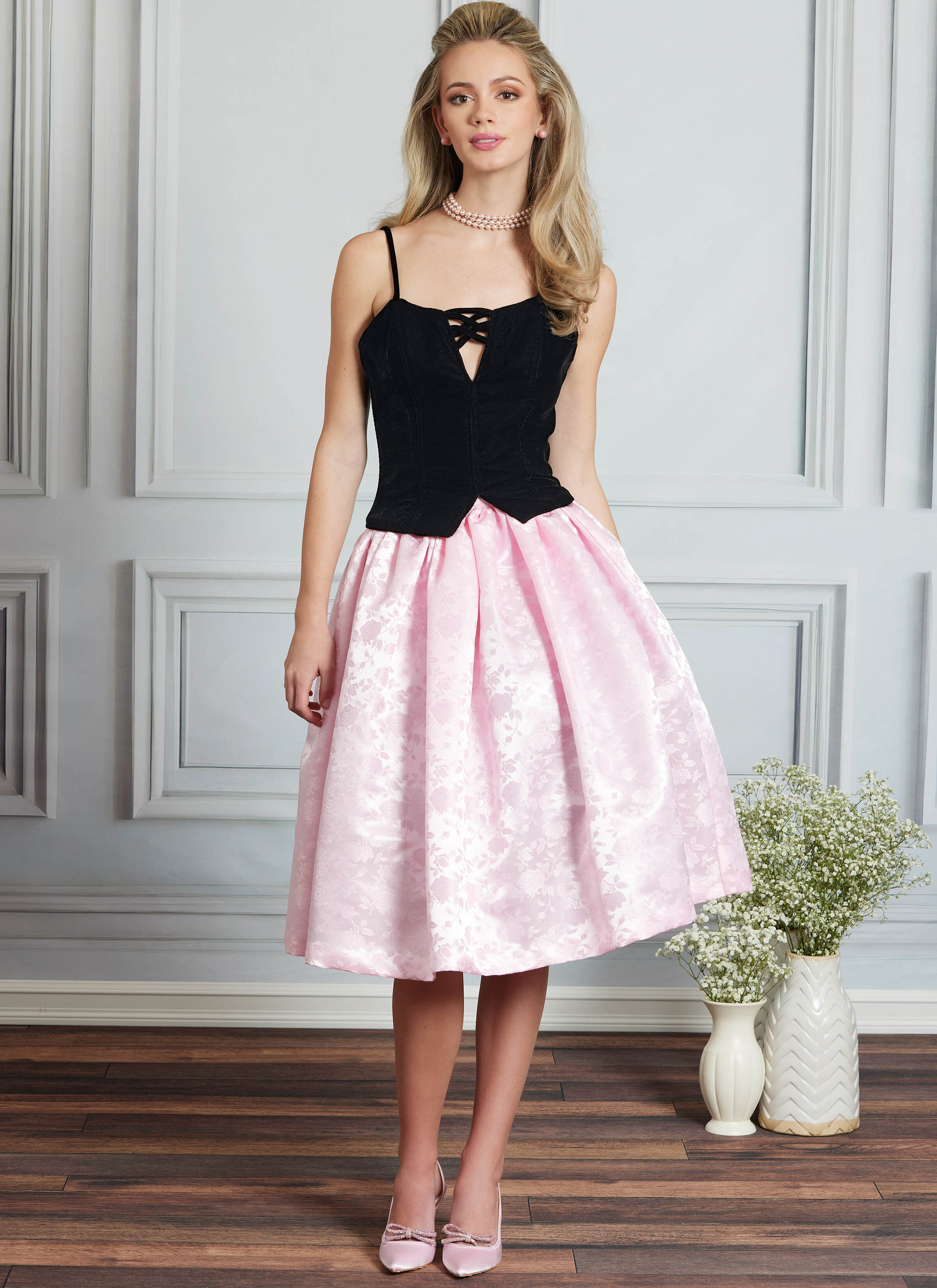 Woman in gold and pink party dress.